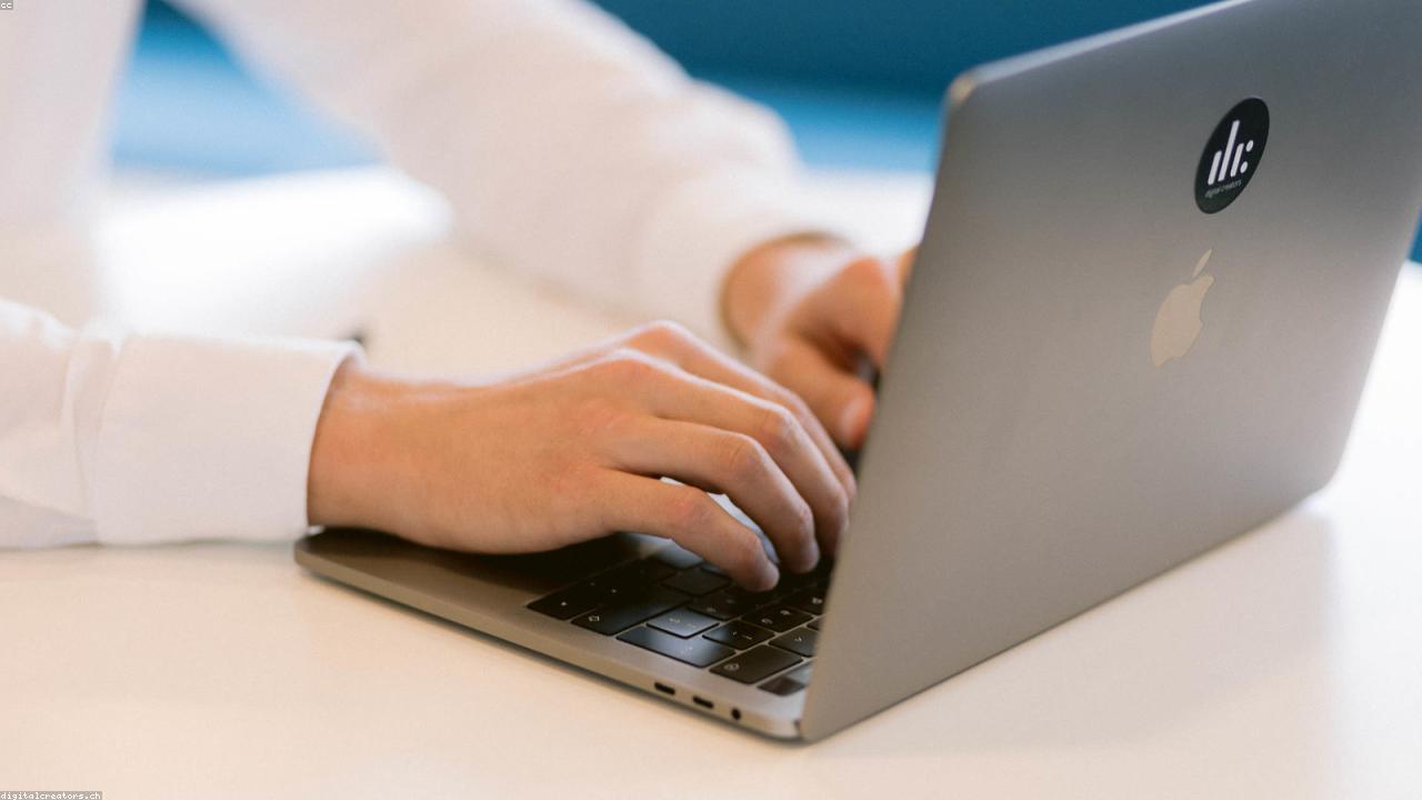 Marketing team reviewing funnel analytics on a laptop and whiteboard.